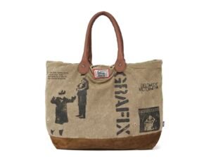 Deva States SS25 tote bag in beige canvas with subtle branding, minimalist design, and utilitarian streetwear details